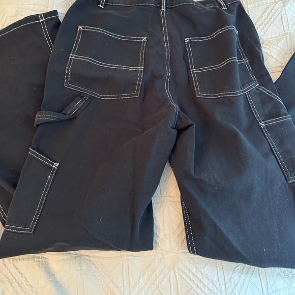 Black Garage Cargo Pants, with white stitching on the side. - Picture 4 of 4